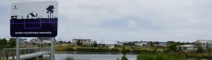 Recycled water sign overlooking a town