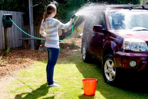Girl washing her car