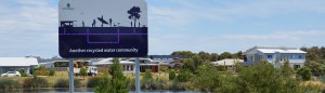 Recycled water banner in front of houses