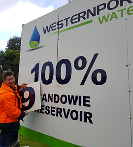 Peter Brown changing sign for Candowie Reservoir