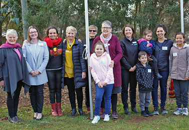 Photo of Aboriginal and Torres Strait Island women supported by Bass Coast community leaders following NAIDOC Week flag raising ceremony.