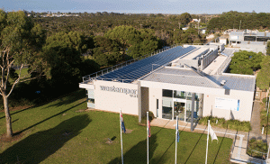 Picture solar panels on roof of corporate building