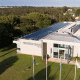 Picture solar panels on roof of corporate building