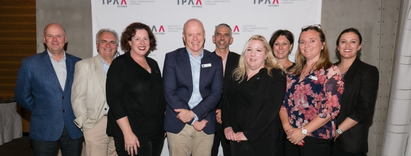 Group photo of management and staff at awards night.