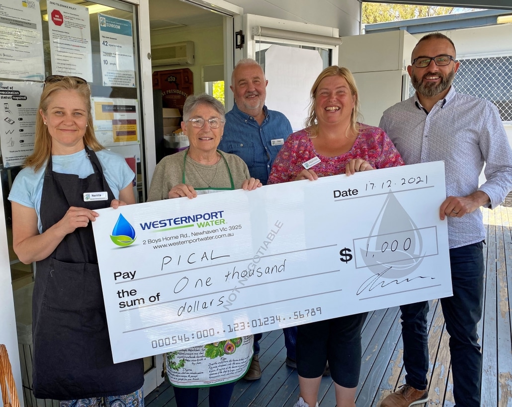 Pictured with a novelty cheque: PICAL volunteers left to right, Nerida Stubbles, Barb Burns, Greg Thompson, Heather Liney, and Geoff Russell from Westernport Water.