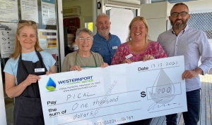 PICAL staff members holding a $1000 cheque