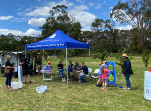 Community engagement stand at outdoor festival