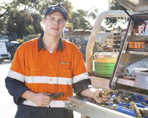 Westernport Water staff member beside a work ute