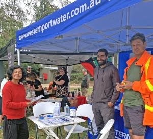 People at a Westernport Water stall at a market