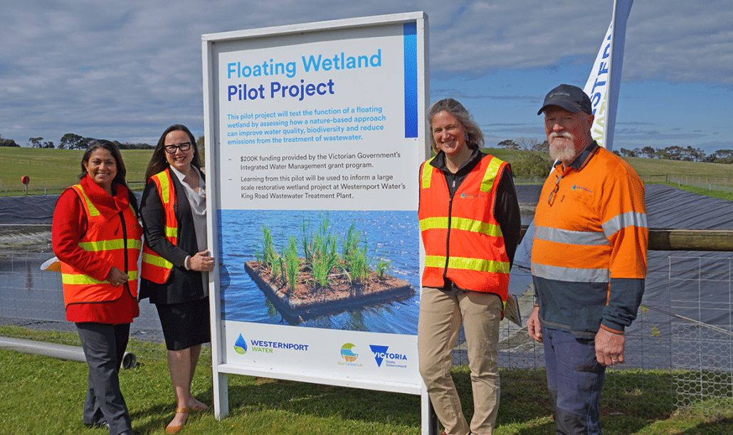 Westernport Water staff and Minister for Water beside a sign for the Floating Wetlands Project