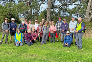 Walking group gathered for a group photo during a tour.